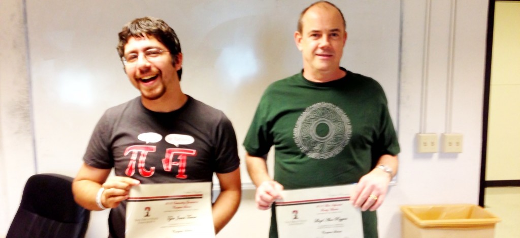 Tyler & Alan standing next to each other holding their certificates